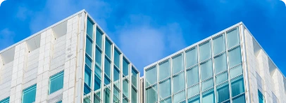 Illustration : ensemble de bâtiments aux façades claires et vitrées.